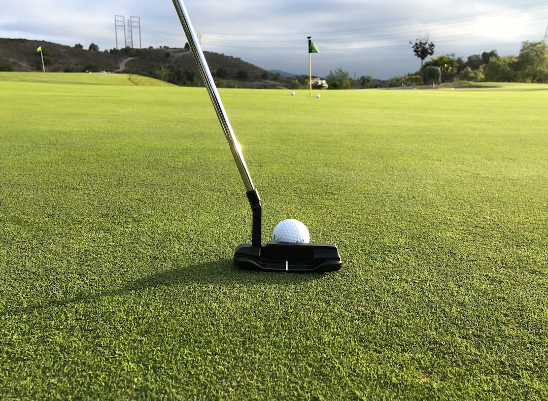 Putting a golf ball on green